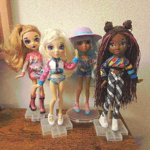 photograph of a shelf of four failfix dolls.