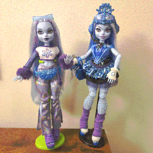 photograph of a shelf of three monster high dolls