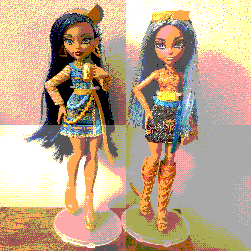 photograph of a shelf of three monster high dolls