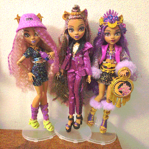 photograph of a shelf of three monster high dolls