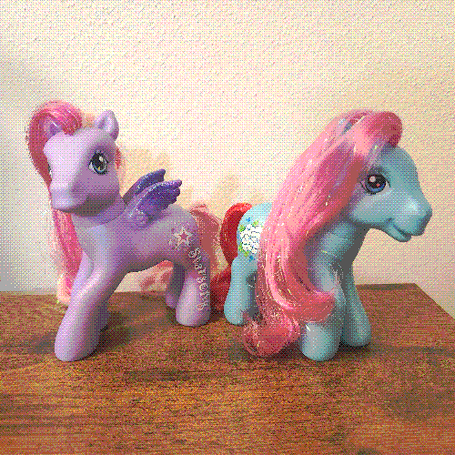 photograph of a shelf of many my little pony figures