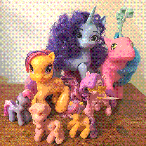 photograph of a shelf of many my little pony figures