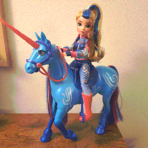 photograph of a doll riding a horse.